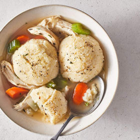 Carolina Grits cooking in creamy souffle with cheesy topper.