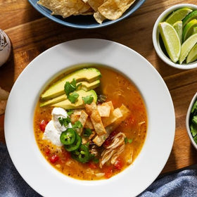 Chili simmering in a pot suggests warm, comforting family dinners.