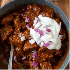 Chili kit displayed with toppings for tailgate meals from Carroll Shelby's
