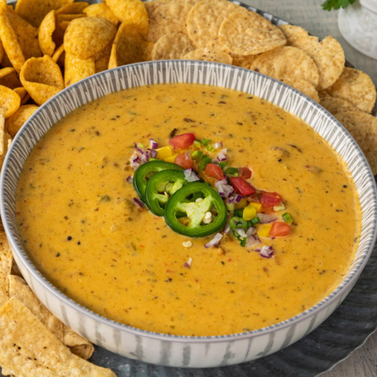 Carroll Shelby's White Chicken Chili ready to serve with toppings.
