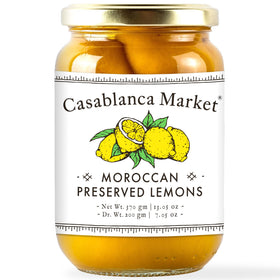 Casablanca Market preserved lemons jar close-up showing vibrant citrus for tagine flavor.