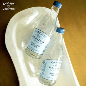 Cascade Mountain mineral-balanced water showing the 7.7 pH level on the label.