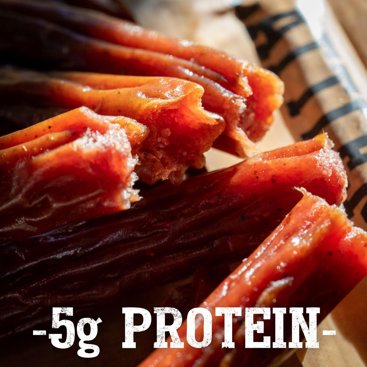 Close-up of Wagyu marbling and hardwood smoke flavor in Cattleman's Cut sticks.