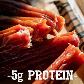 Close-up of Wagyu marbling and hardwood smoke flavor in Cattleman's Cut sticks.