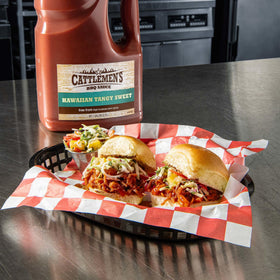 Cattlemen's sauce poured on pulled pork for quick flavor