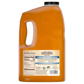 Pouring Cattlemen's Carolina Tangy Gold BBQ sauce for quick glaze