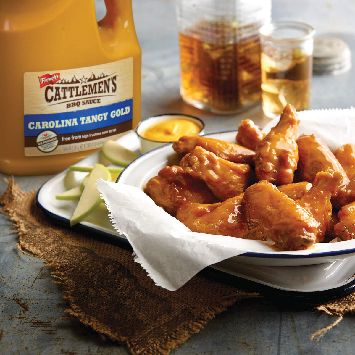 Crispy wings with Cattlemen's Tangy Gold BBQ sauce and pork rind crumbles