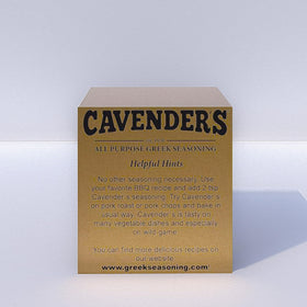 Cavender's Greek Seasoning shaker sprinkling on meat for enhanced taste