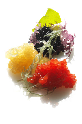 Caviart canapés with black seaweed caviar, elegant dairy-free garnish.