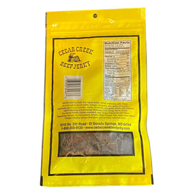 Cedar Creek Beef Jerky close-up shows grain-finished beef with bold flavor.