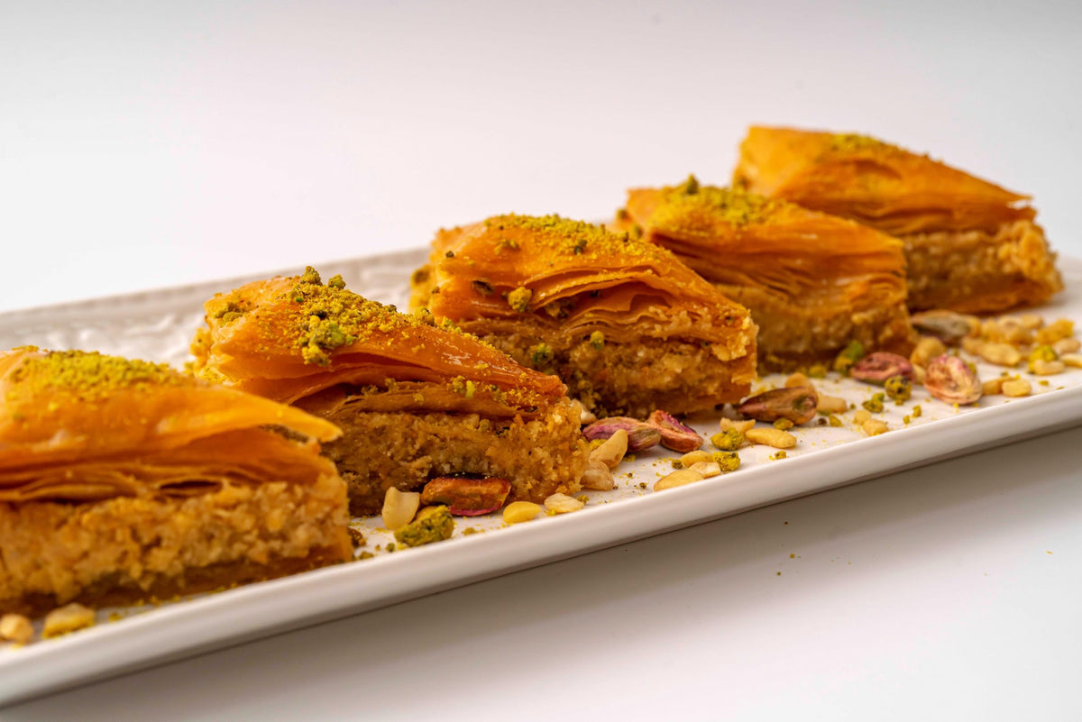 Cedar Pastries triangle baklava with almonds, pairing nicely with coffee.