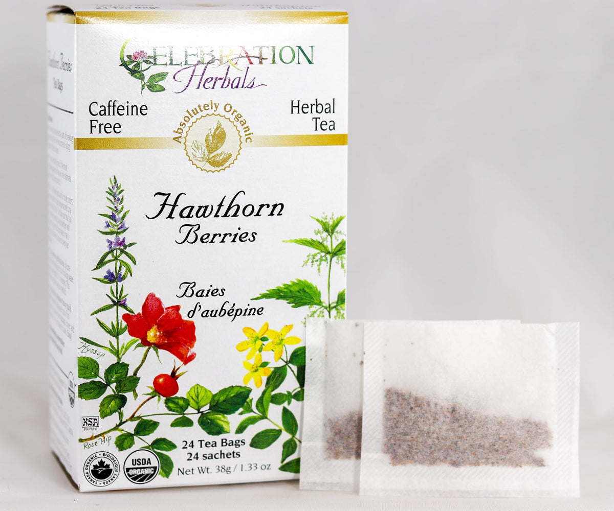 Stovetop steeping Celebration Herbals Hawthorn Berries Tea Bags in a cup.
