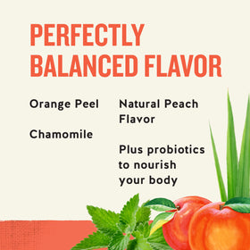 Tea bag steeping in hot water with Peach + Probiotics blend