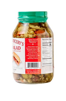 Central Grocery Olive Salad muffuletta assembly demonstrates authentic sandwich topping.