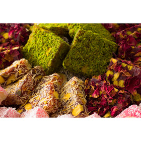 Cerez Pazari dried rose leaves garnish and pistachio powder accents.