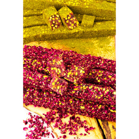 Cerez Pazari pistachio powder garnish detail on the treats.
