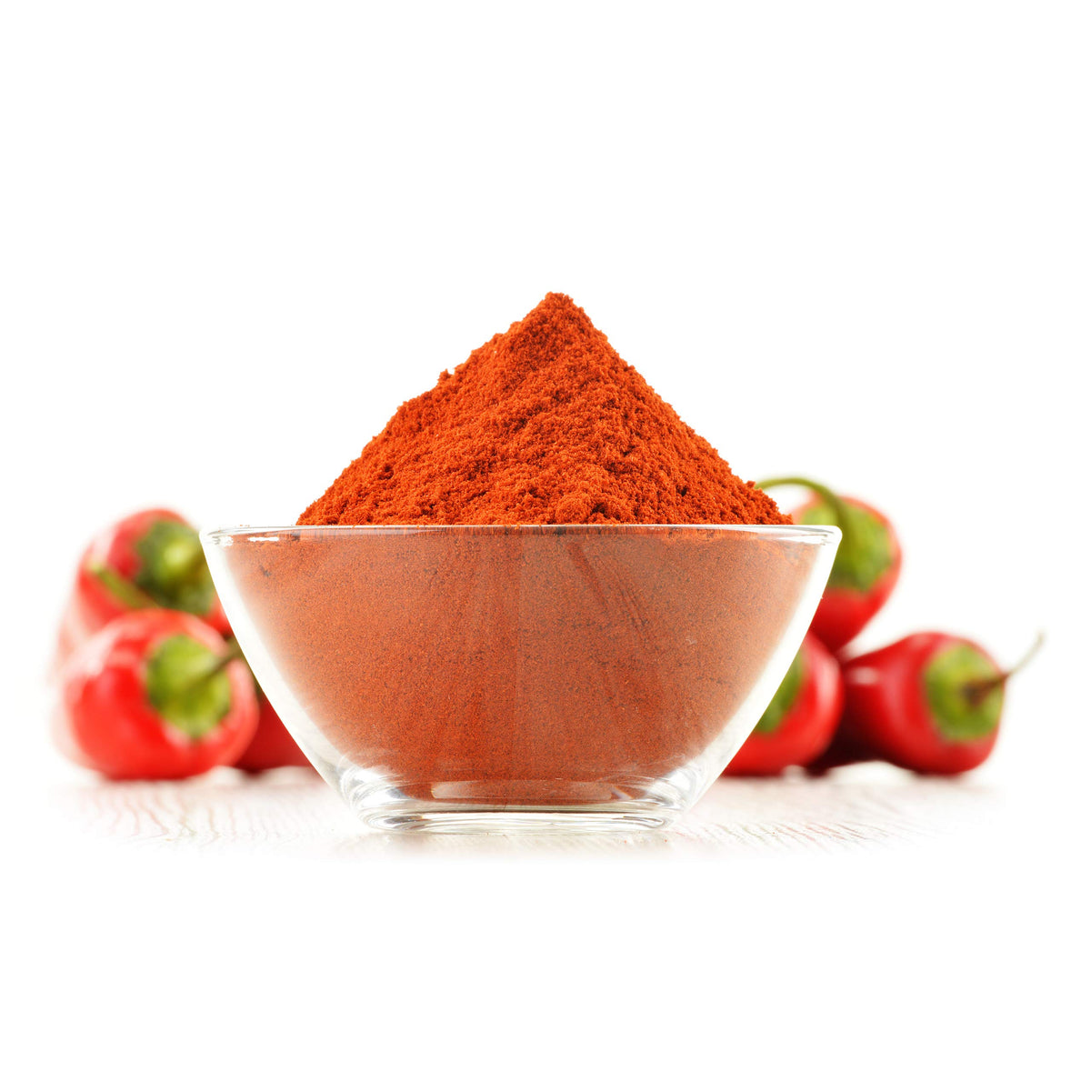 Cerez Pazari spice dispensing scoop with cayenne powder for easy seasoning.