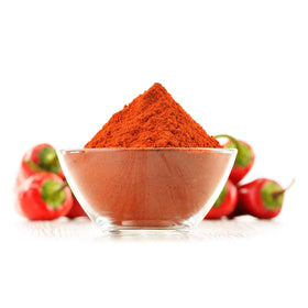 Cerez Pazari spice dispensing scoop with cayenne powder for easy seasoning.