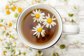 Cha4TEA chamomile pods arranged on a shelf suggest daily tea moments.