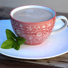 Chaikhana Chai concentrate being poured into a glass for a comforting cup