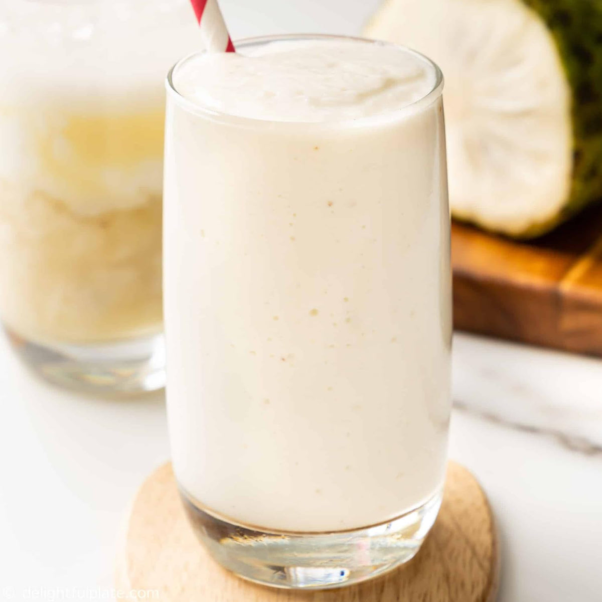 Powder being whisked into a refreshing Cham Organics Soursop drink