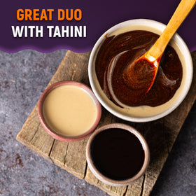 Chargio grape molasses glass with spoon reveals rich color and aroma.