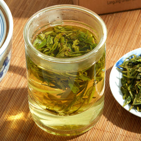 ChaWuWarmSun tea steeping in cup releasing mellow aroma.