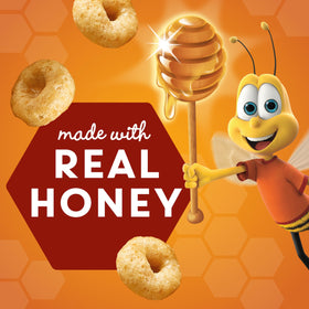 Cheerios Honey Nut cereal cup close-up flakes, toasted honey Os flavor.