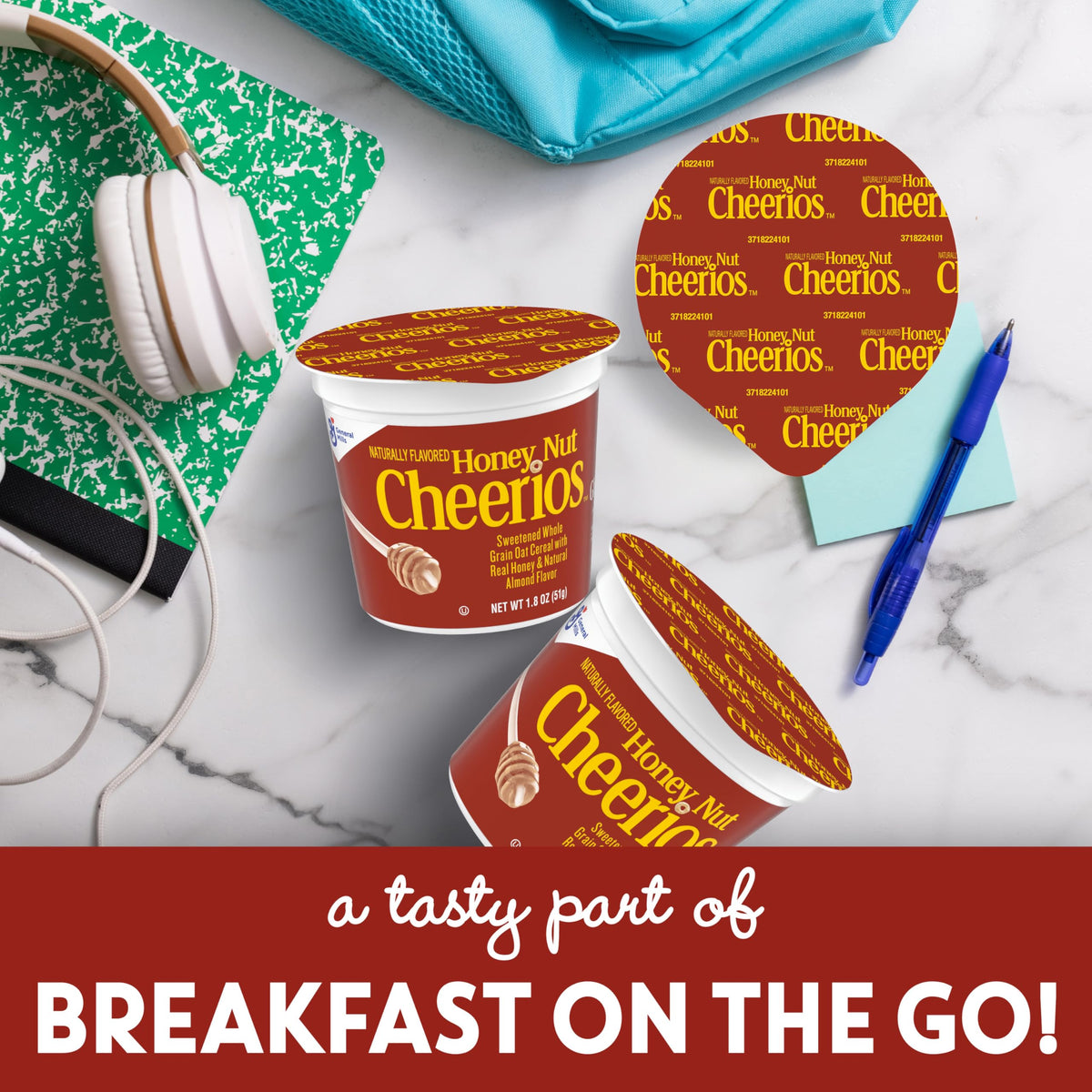Cheerios Honey Nut cereal cup on table, ideal quick snack for busy days.