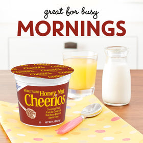 Cheerios Honey Nut cereal cup with milk, ready for a fast breakfast.