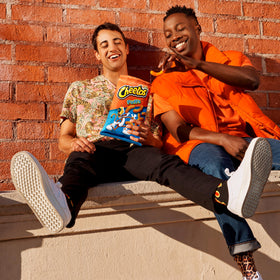 Cheetos Cheese Puffs hand-held bag suggesting portable snack option.
