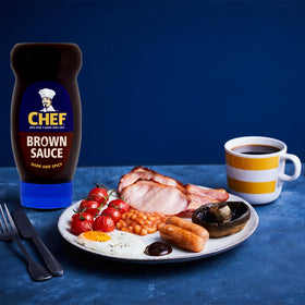 Pouring Chef Brown Sauce over mash to elevate bacon dishes