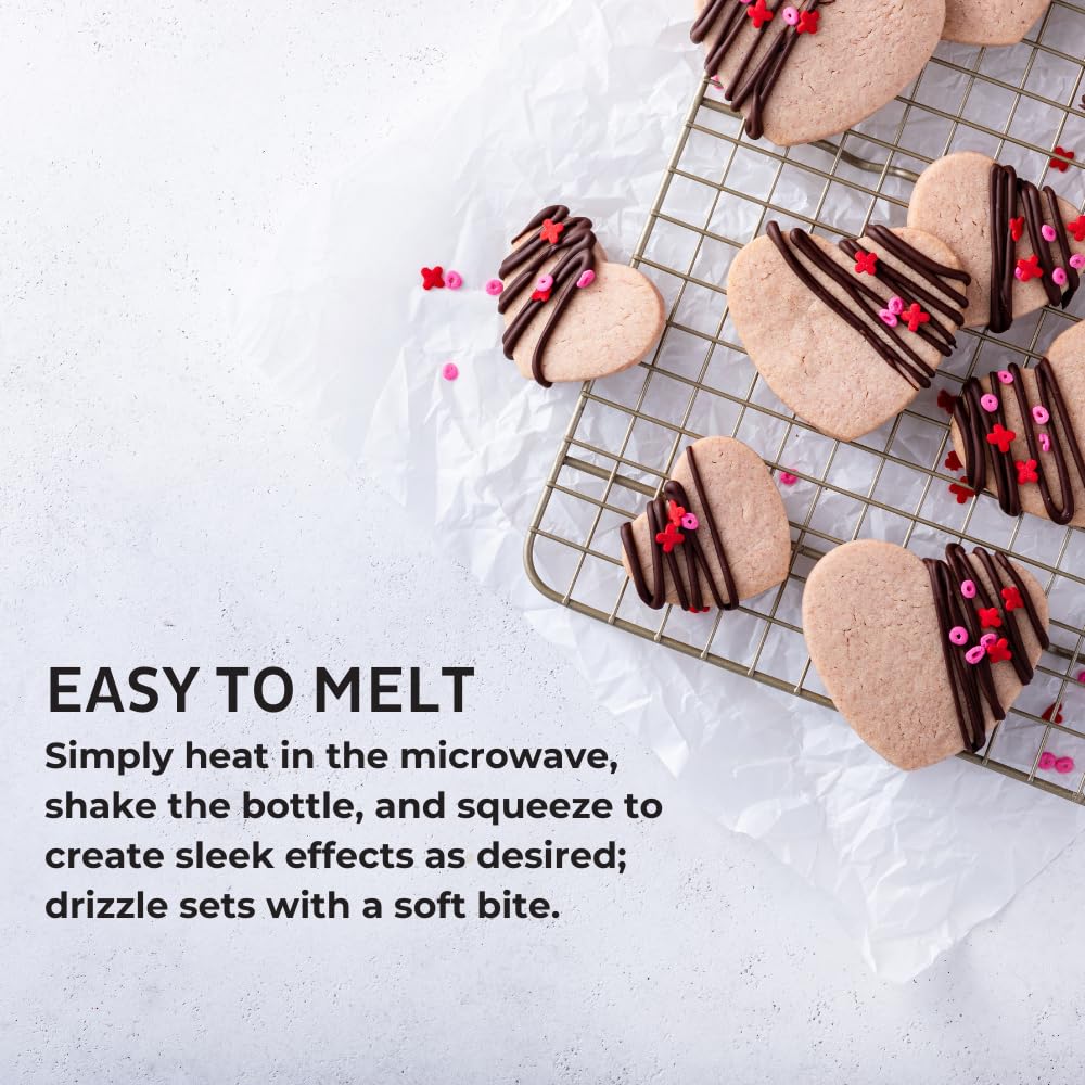 Chefmaster chocolate drizzle over strawberries for a shiny dessert finish.