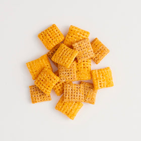 Chex Mix Simply Chex Cheddar on table, family-friendly snack option.