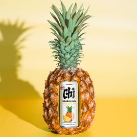 CHI FOREST Pineapple sparkling water picnic scene with cans on a blanket