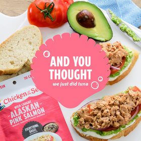 Chicken of the Sea pink salmon packets on a fresh salad for quick meals