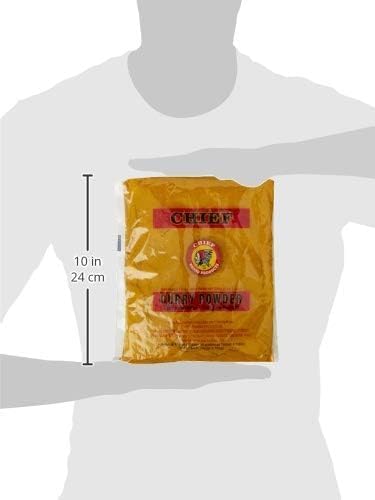 Pouring Chief Brand Curry Powder into a pan enhances dish aroma and color.