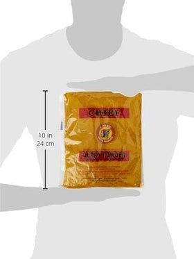 Pouring Chief Brand Curry Powder into a pan enhances dish aroma and color.