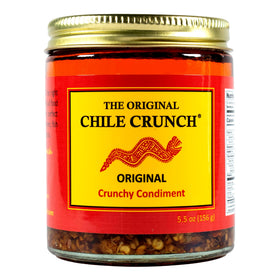 Chile Crunch Original Spicy bottle pour showing bold flavor ready for toppings
