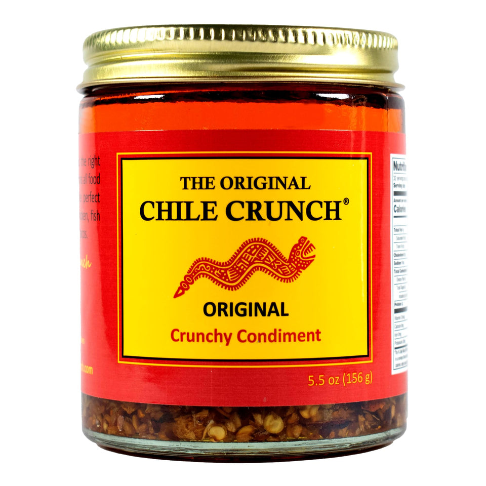Chile Crunch Original Spicy bottle pour showing bold flavor ready for toppings