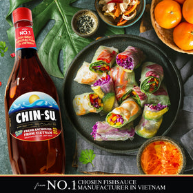 Chin-Su premium Vietnamese fish sauce bottle close-up highlights amber color and savor.
