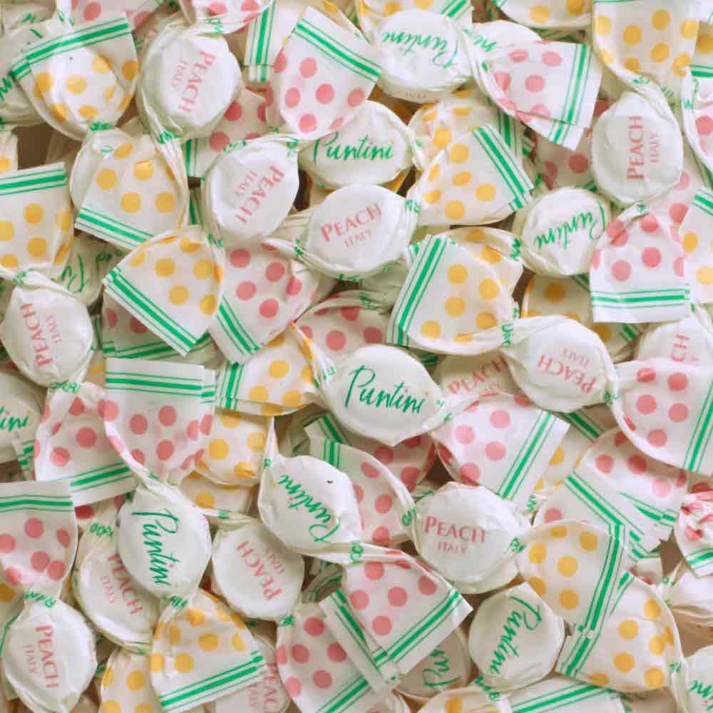 Close-up of Chipurnoi Puntini peach jujubes highlighting juicy peach flavor