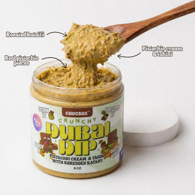 Pistachio-tahini with kataifi cross-section reveals creamy filling and crispy shards