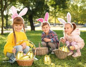 Chochkees Easter party decor table with shimmering golden eggs and prizes