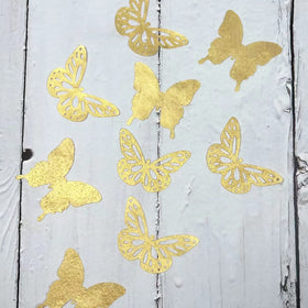 CHOCKACAKE gold butterflies attached with icing on cakes
