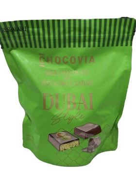 CHOCOVIA pistachio close-up — creamy milk chocolate with a crunchy texture.