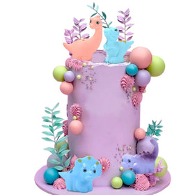 ChoJoy dinosaur cake toppers with pink, purple and blue balls for festive cake decorating.