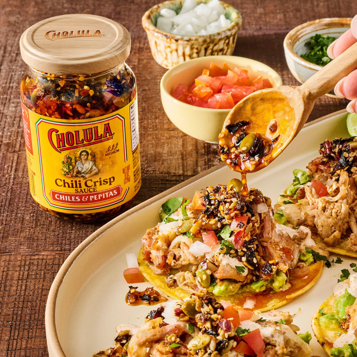 Pizza finished with Cholula Chili Crisp adds heat and texture.