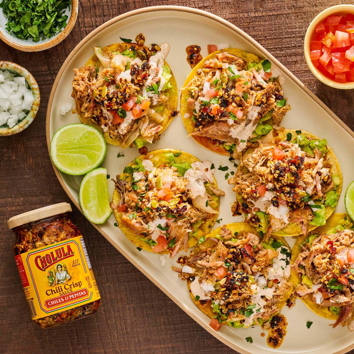 Cholula chili crisp over tacos enhances flavor and crunch.