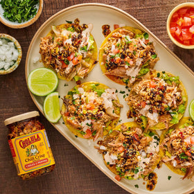 Cholula chili crisp over tacos enhances flavor and crunch.